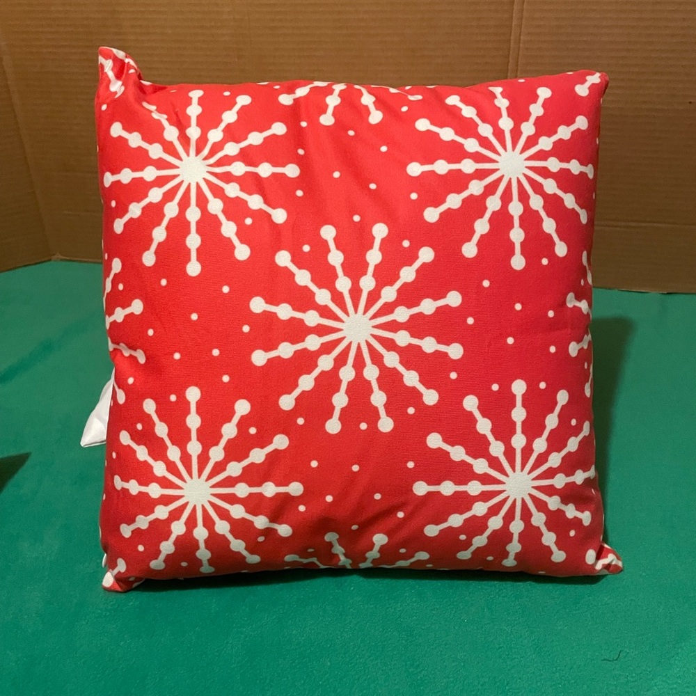 Bright red dotted snowflake throw pillow